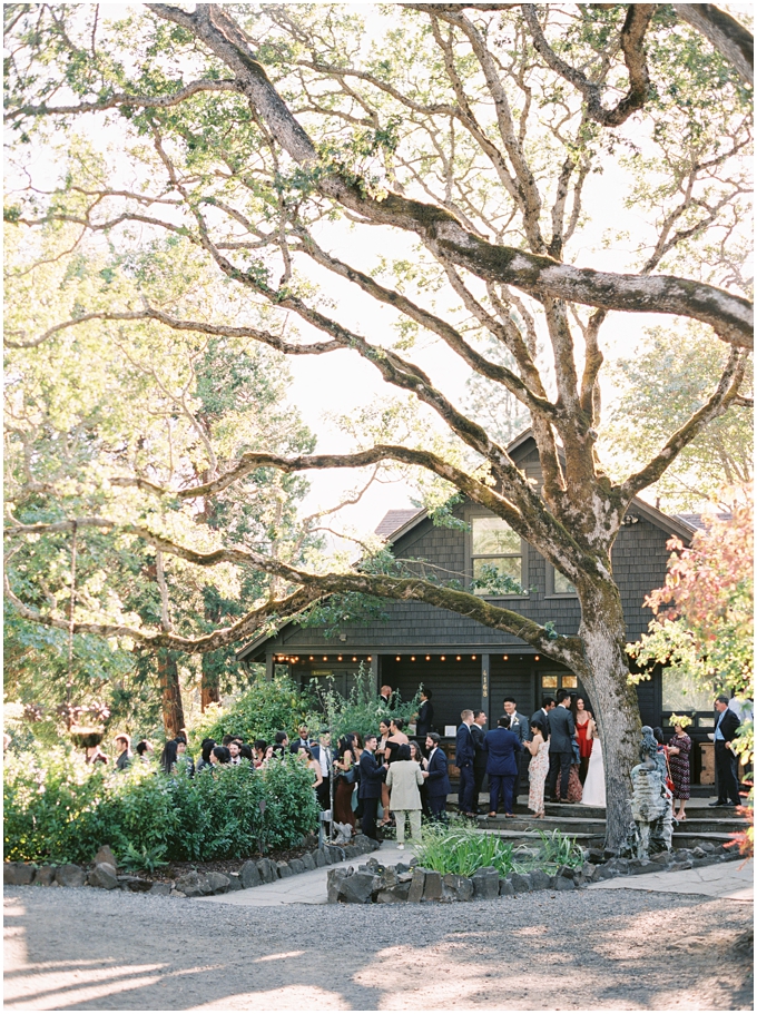 guests gathered for cocktail hour in front of the griffin house